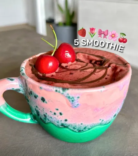 Chocolate cherry smoothie in a pink and green mug, with the caption “5 smoothie”