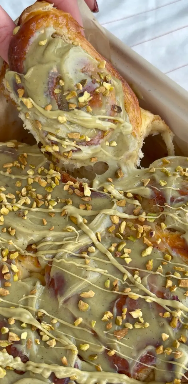 Tray of buns with pistachio glaze and chopped pistachios