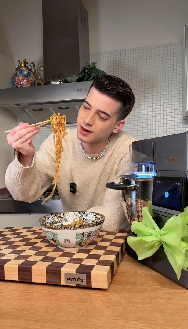 Kenwood — creator eating noodles next to the stand mixer